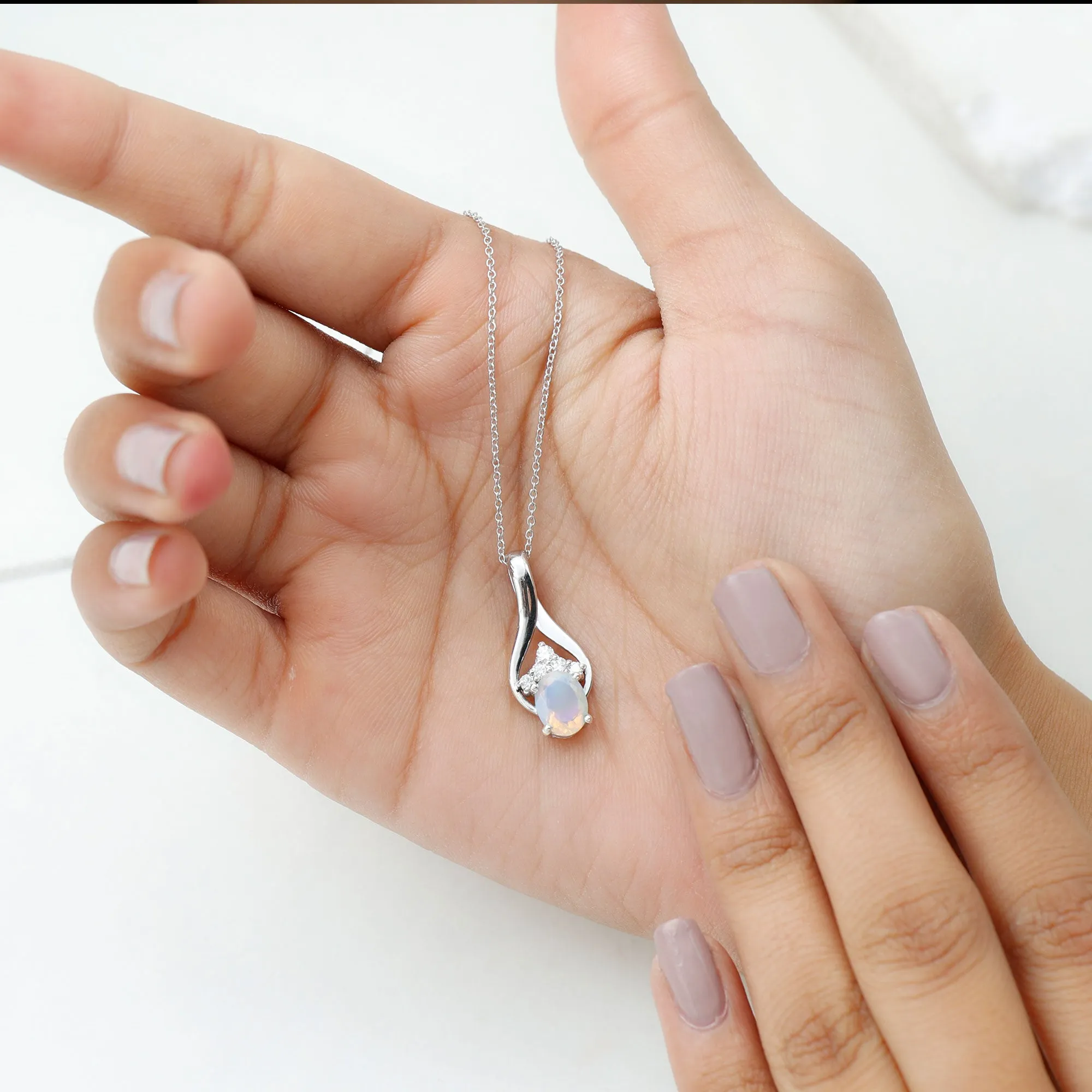 Oval Ethiopian Opal and Moissanite Teardrop Pendant