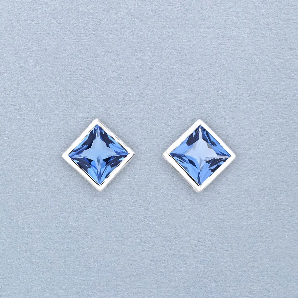 Sterling Silver Princess Cut Blue Topaz Stud Earrings